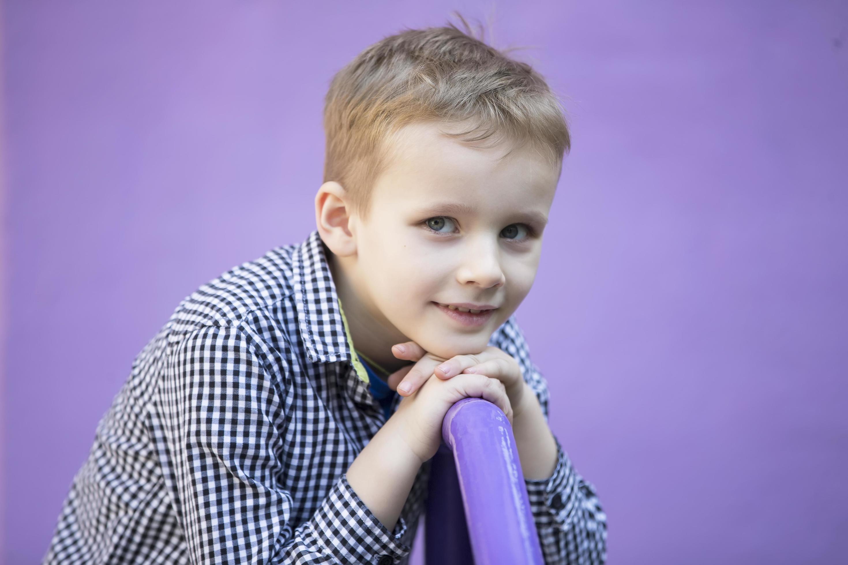 Six year old boy. Primary school student. Preschooler. Child on a purple background. 22276053