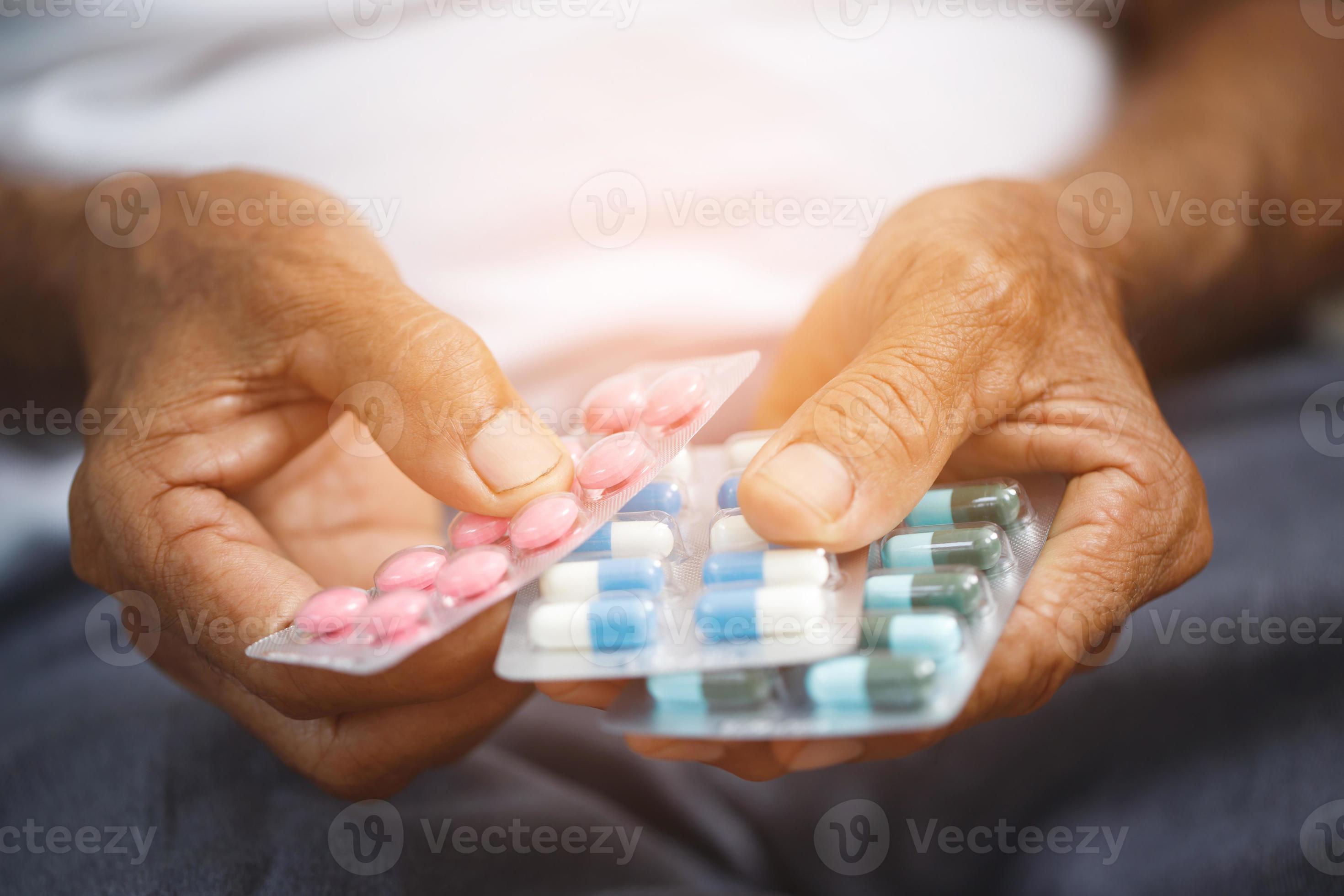 Elderly take painkillers to treat disease. 22276209 Stock Photo at Vecteezy