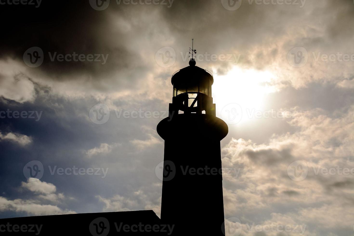 Lighthouse by the sea photo