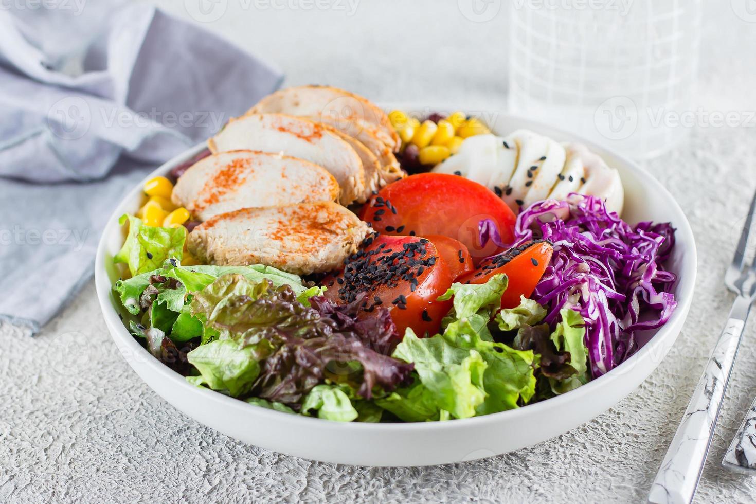 Balanced lunch in bowl. Healthy food concept. Light concrete background. photo