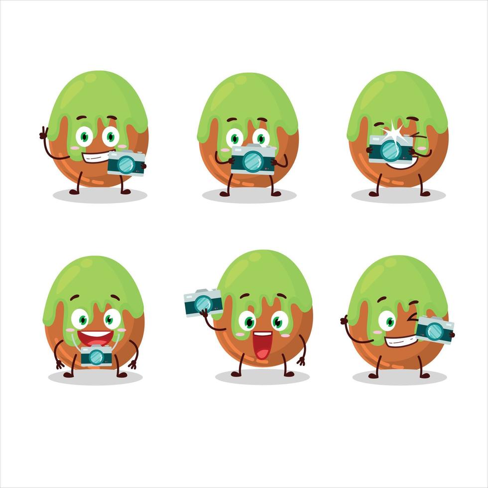 Photographer profession emoticon with choco green candy cartoon character vector