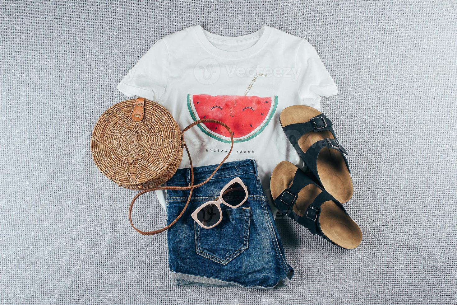 Vacation, travel concept. Flat lay with summer women's clothing and accessories. photo
