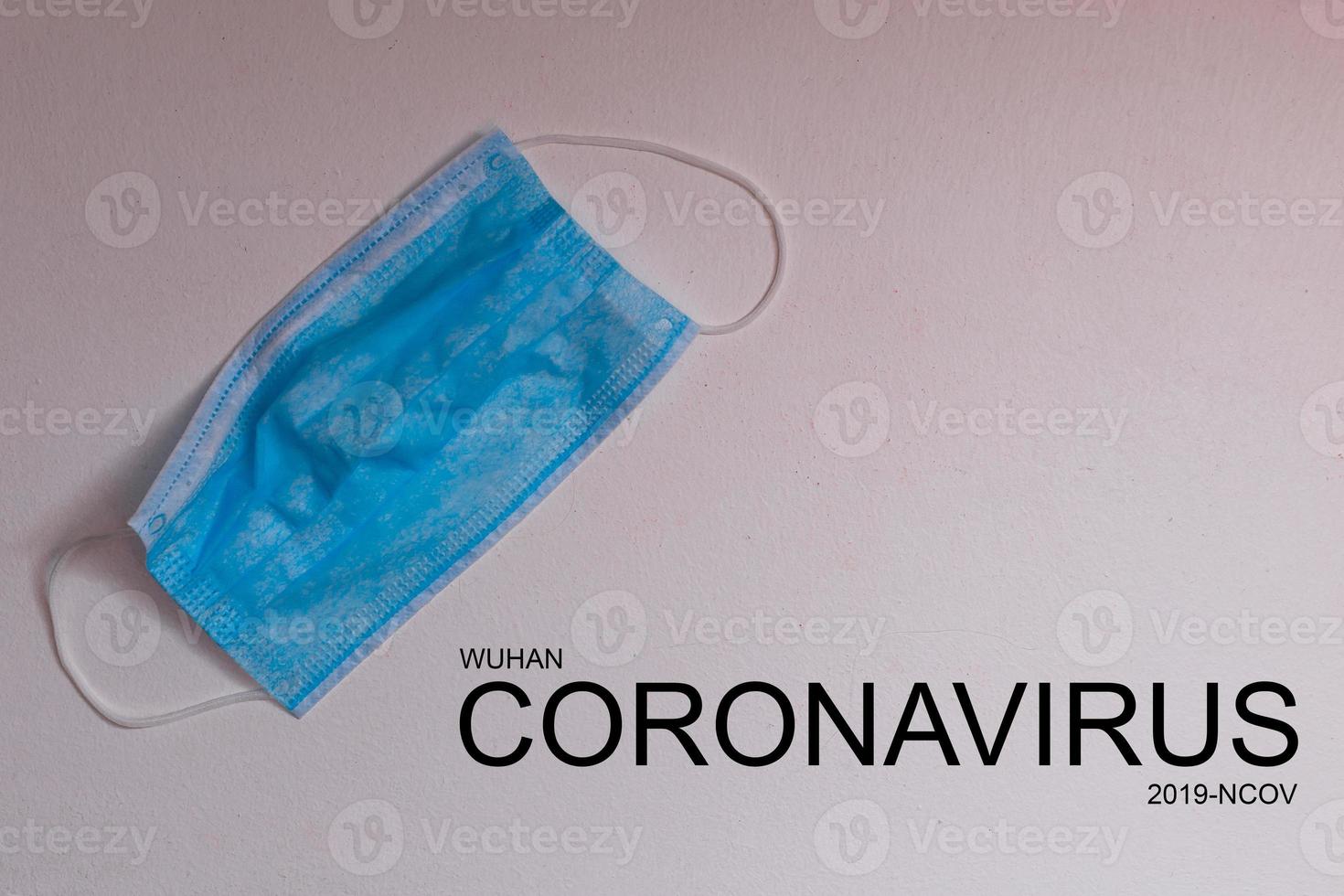 Text phrase Coronavirus on a gray background with protective masks. Novel coronavirus 2019-nCoV, MERS-Cov middle East respiratory syndrome coronavirus. photo