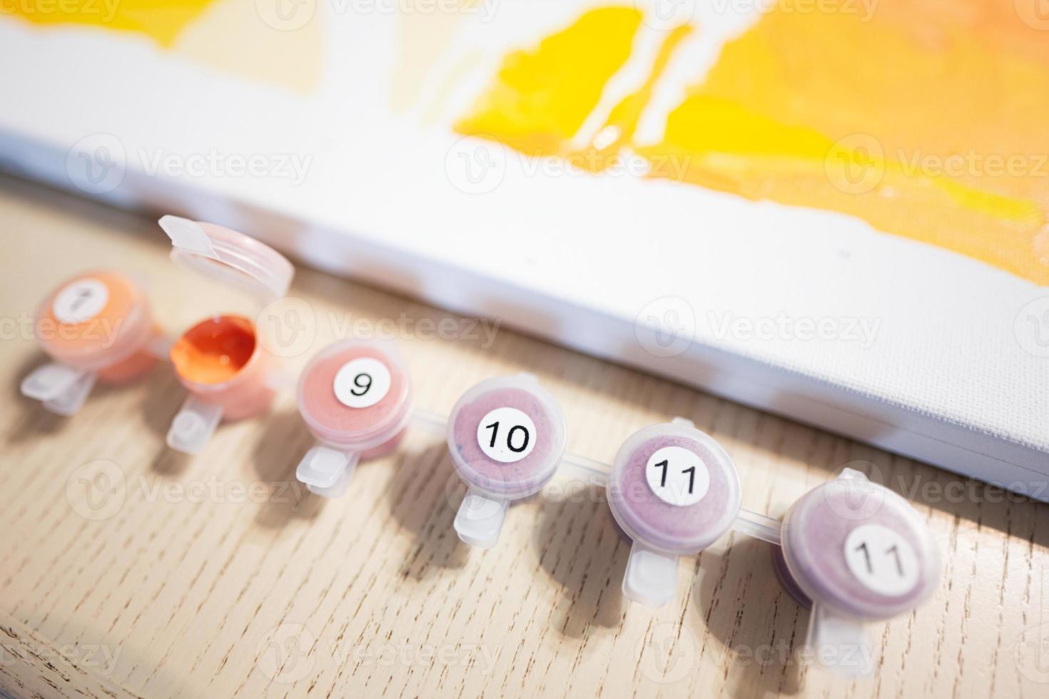 Painting by numbers with gouache at home. photo