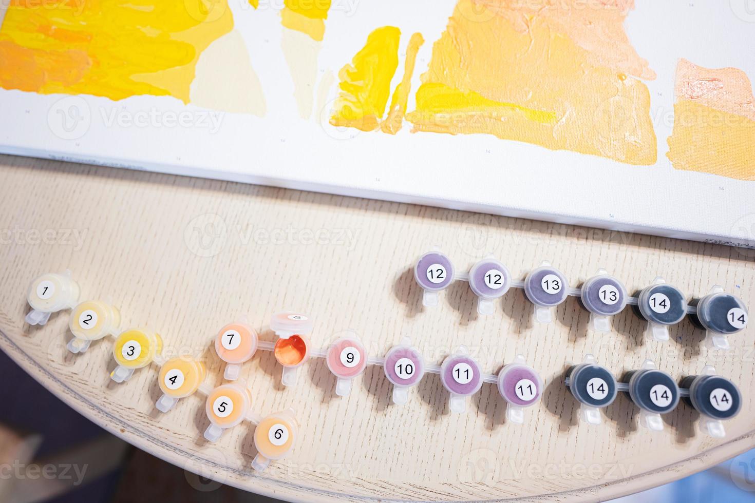 Painting by numbers with gouache at home. photo