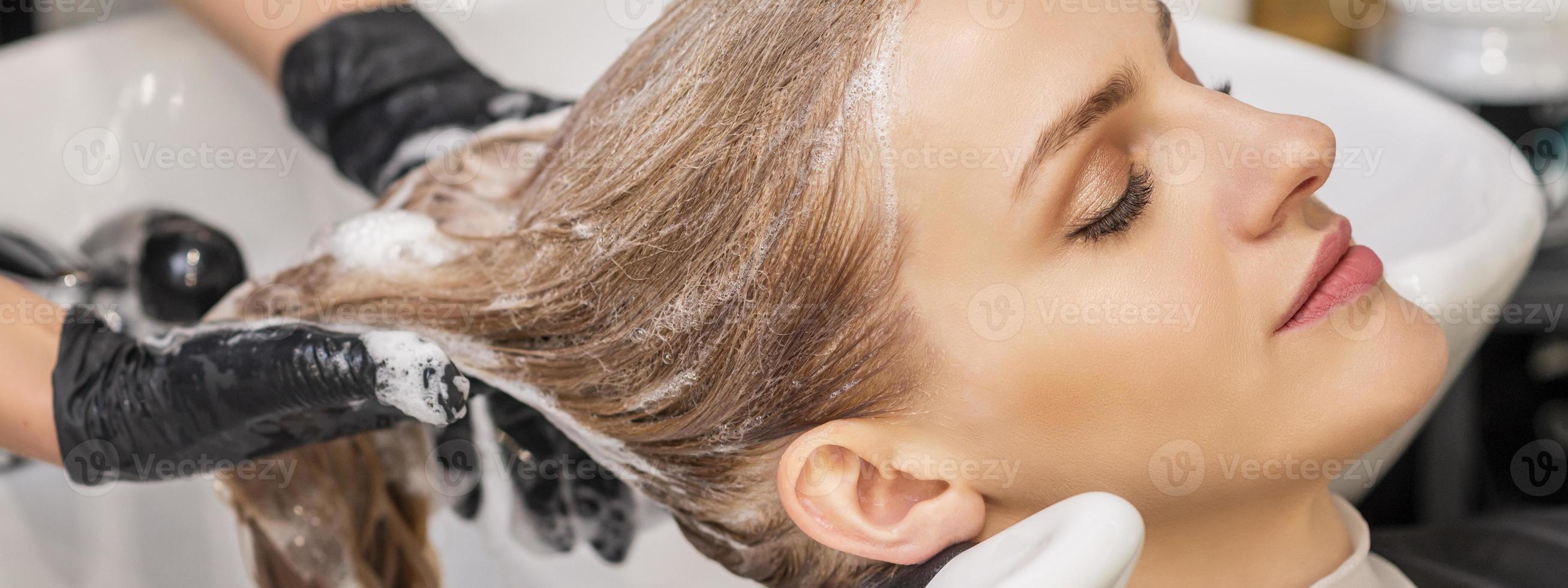 Woman receiving wash her hair photo