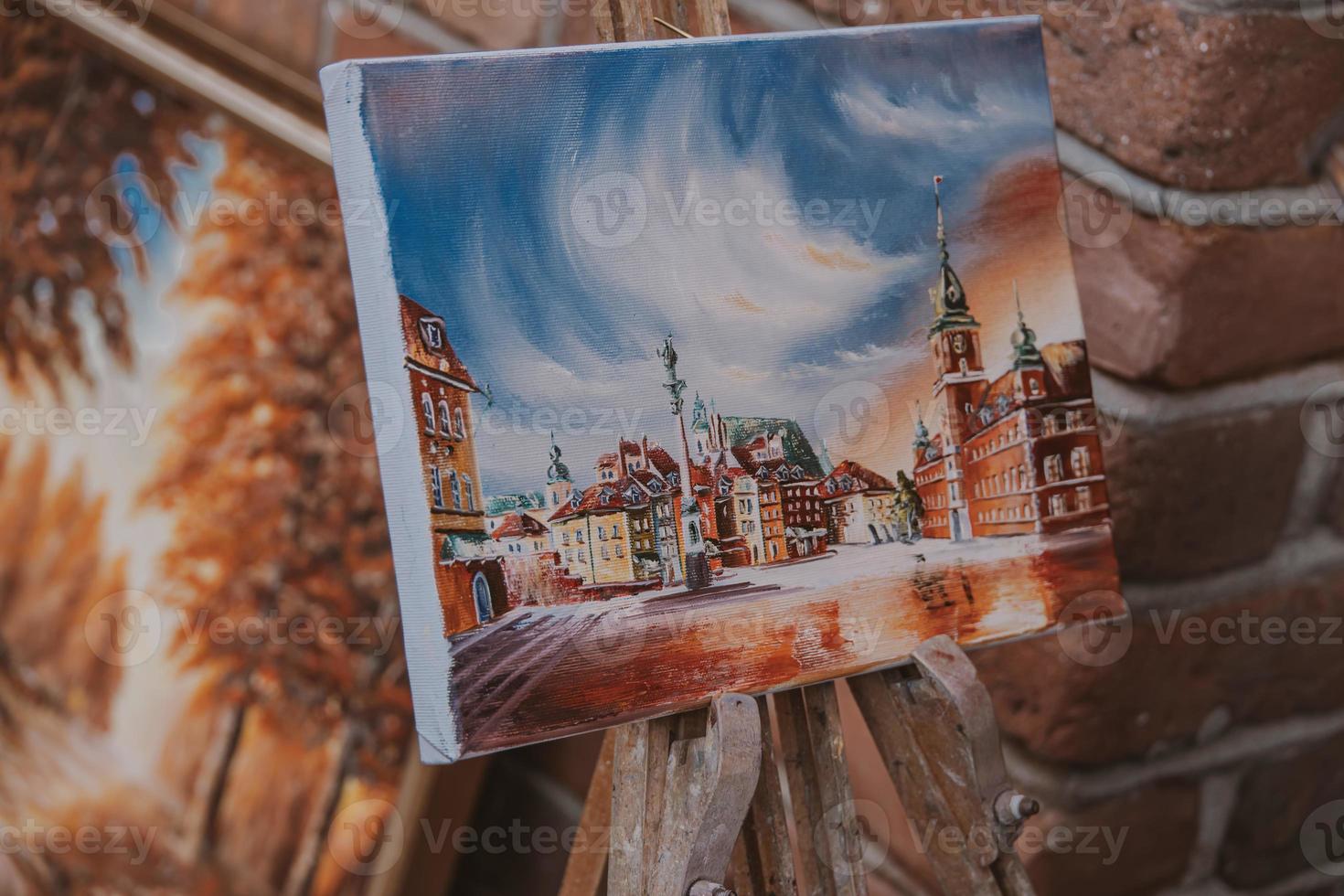 paintings on canvas showing the old town of warsaw in poland souvenirs from holidays photo