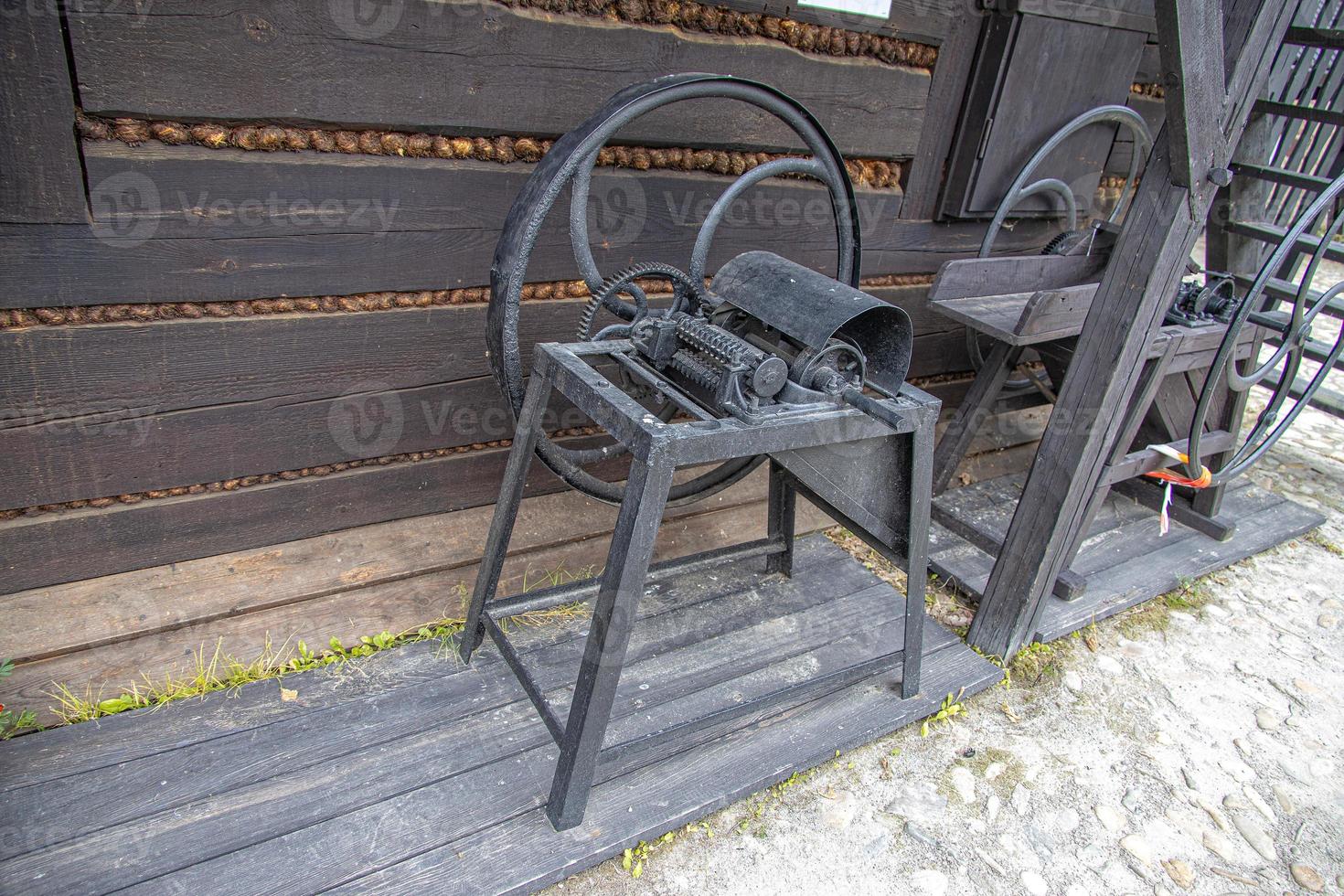 antique metal farm machinery in an open-air museum photo