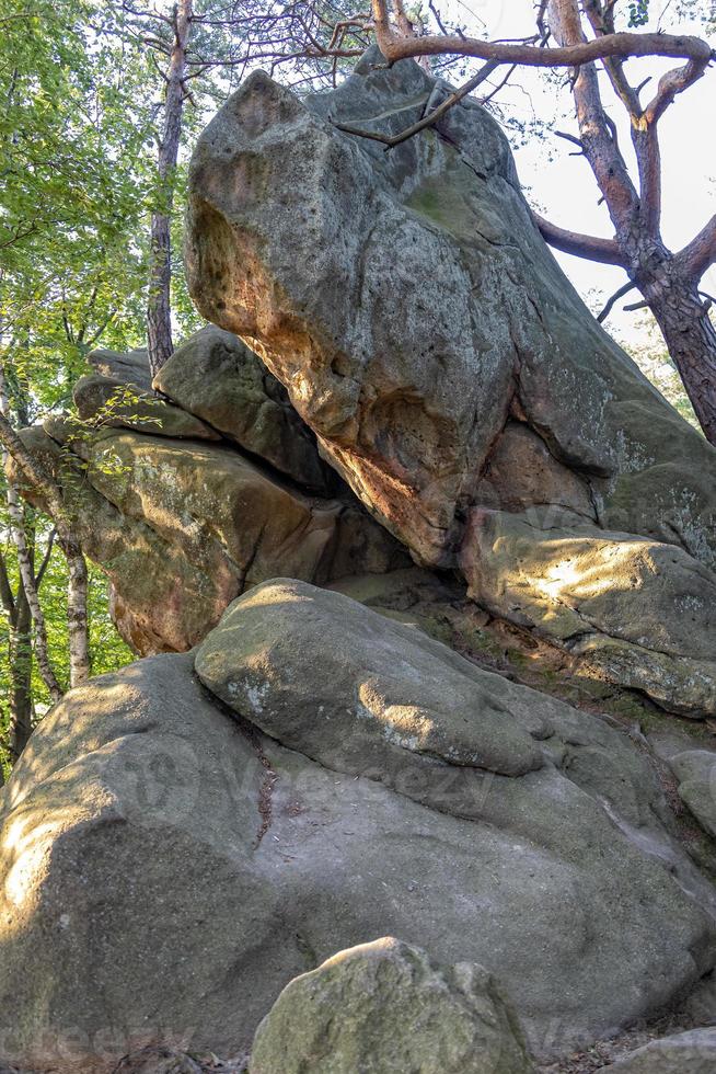 devil stone in a forest in the mountains of Pogorzyce in Poland on a summer day photo