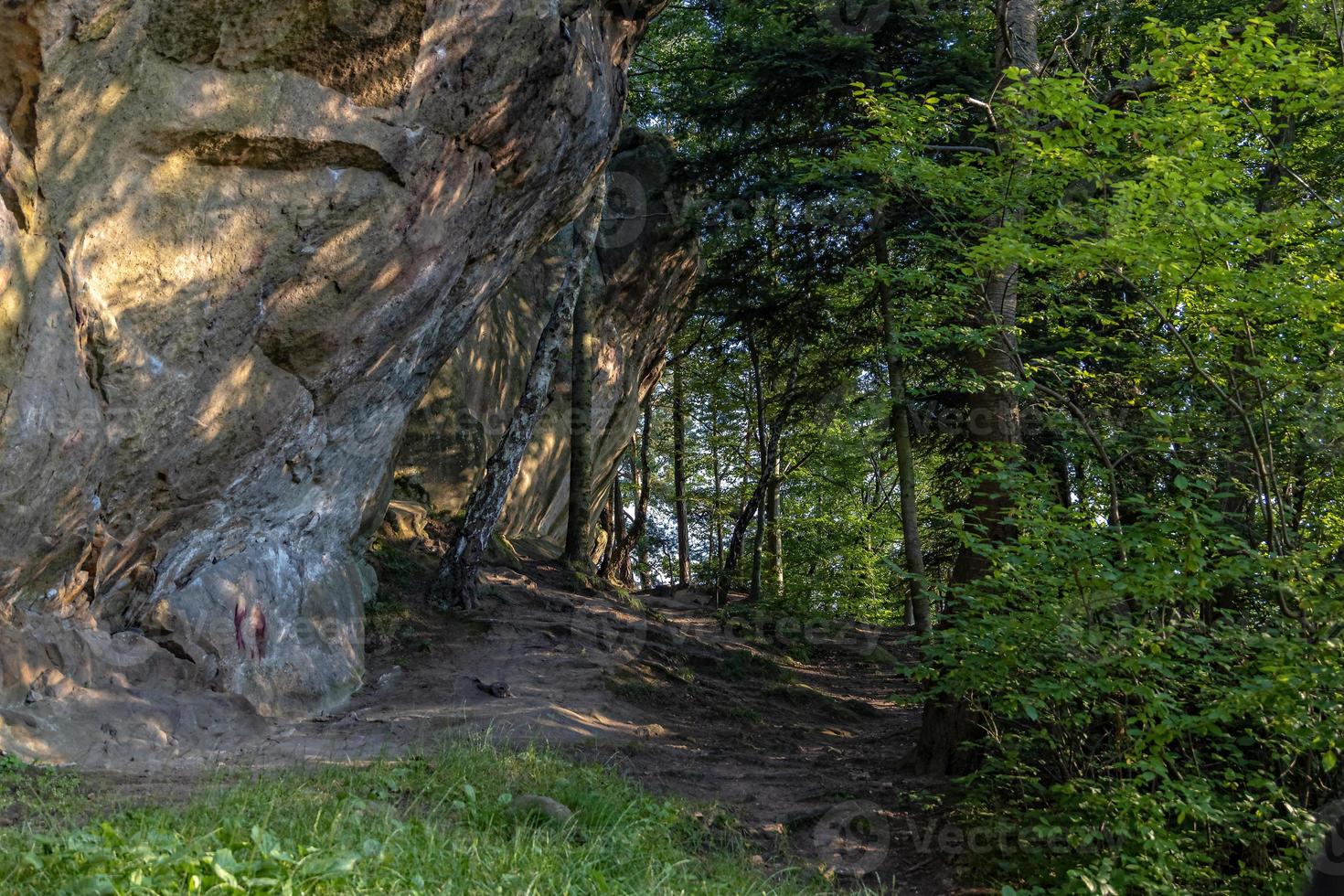 devil stone in a forest in the mountains of Pogorzyce in Poland on a summer day photo