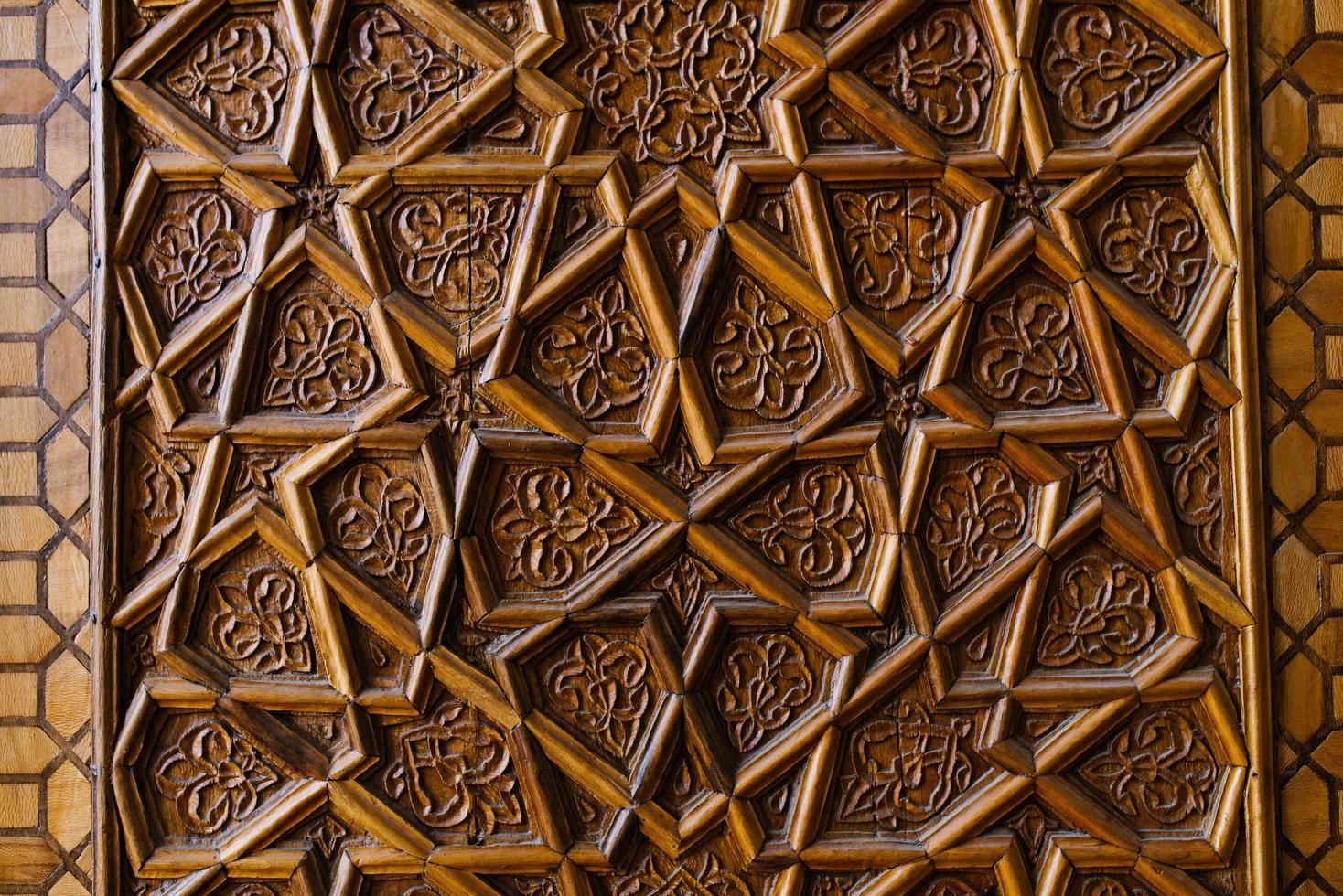 Bukhara, Uzbekistan. December 2021. Asian pattern, wood carving photo