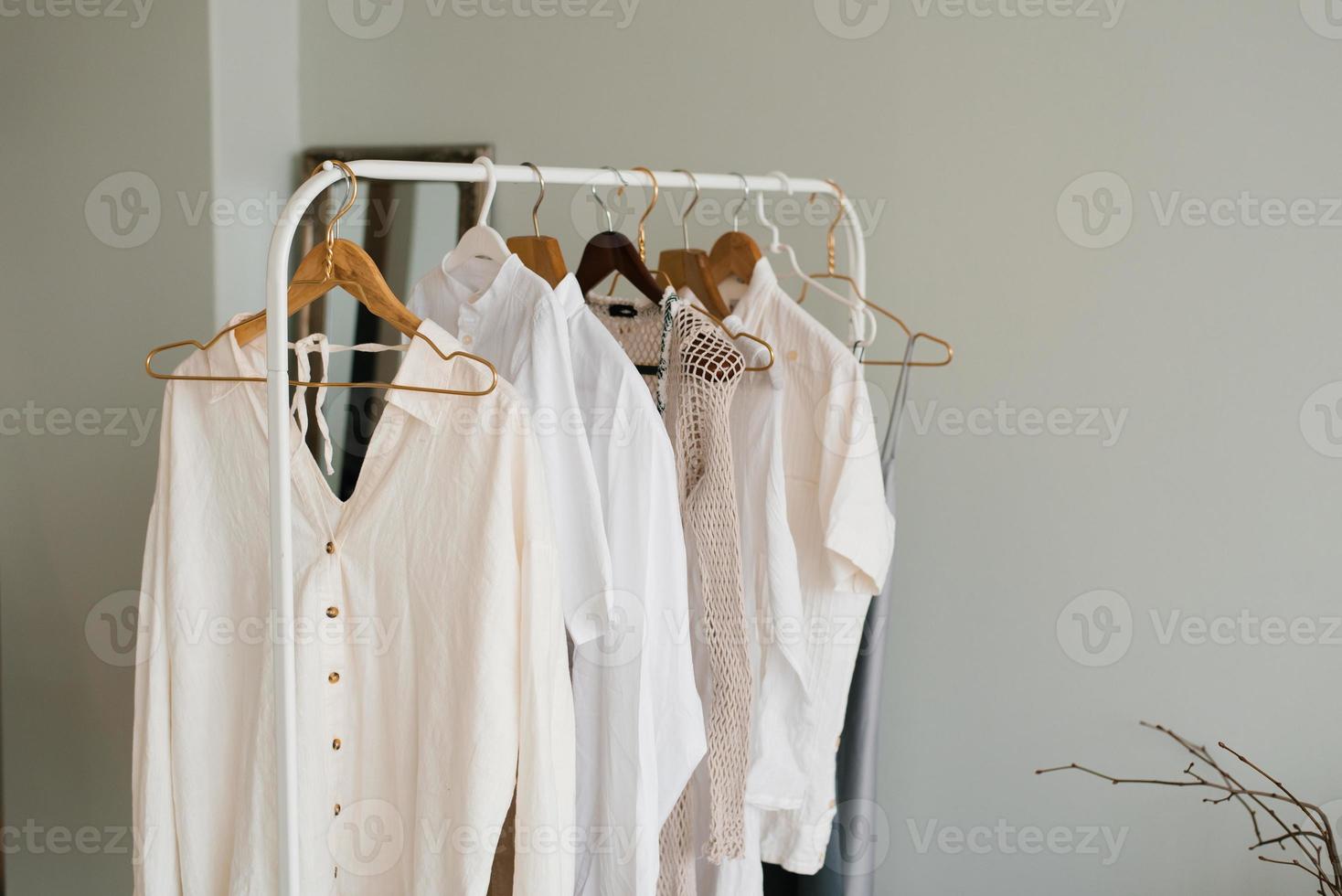 Modern interior of an open dressing room with a hanger for stylish women's clothing photo