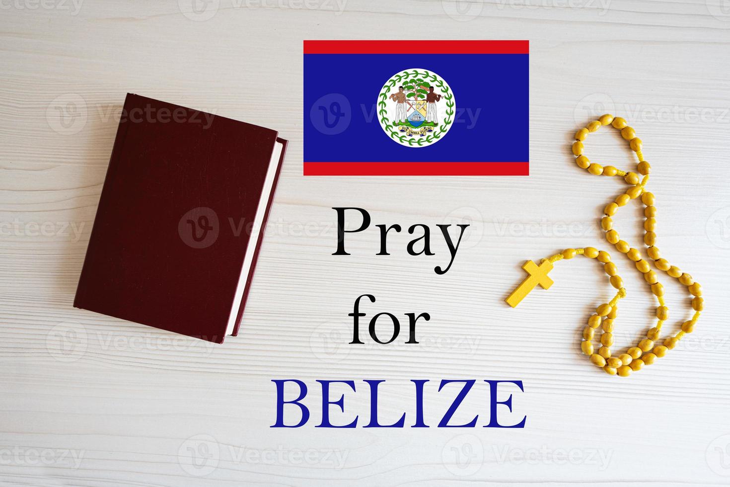 Pray for Belize. Rosary and Holy Bible background. photo