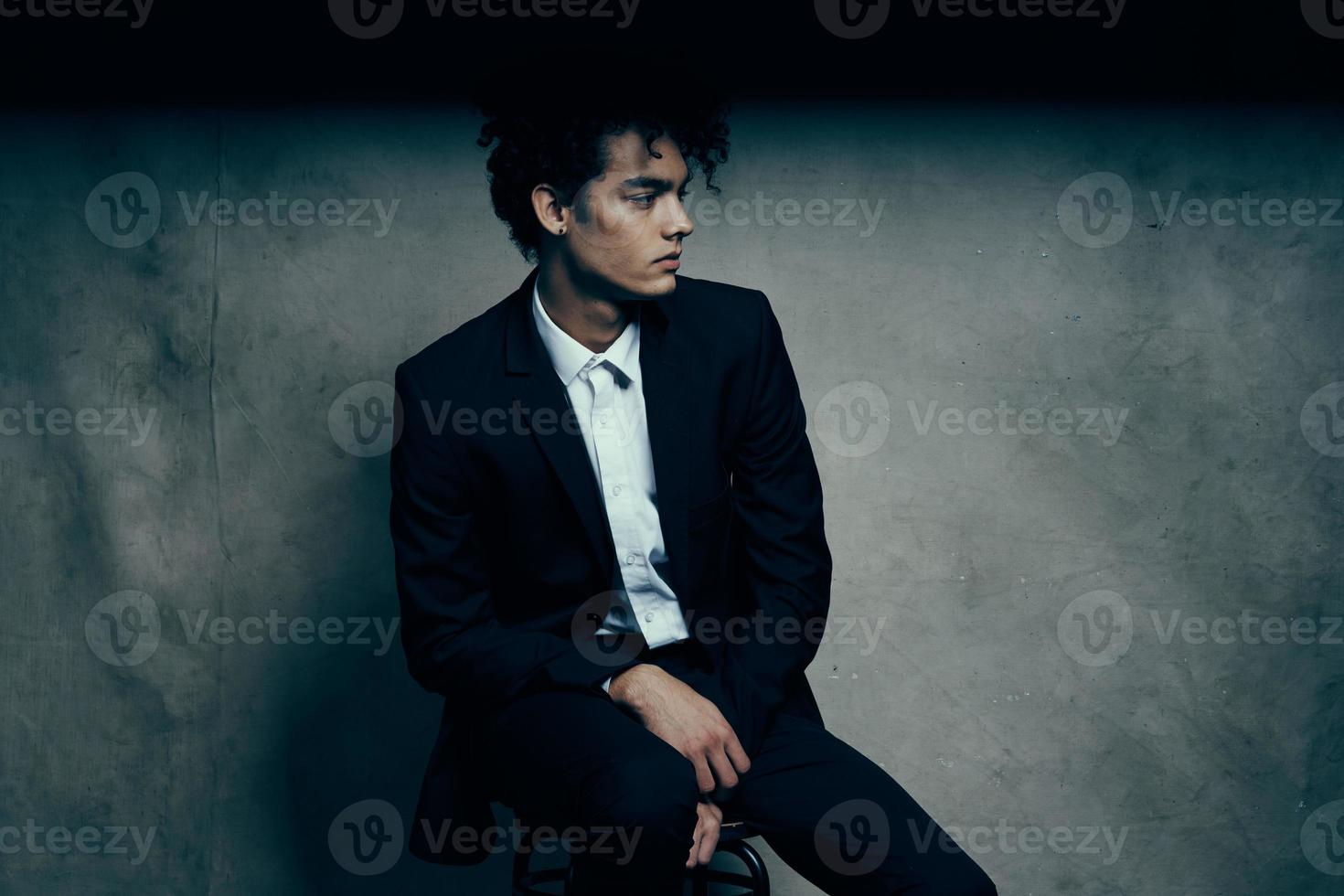 business man in a suit sitting on a chair fashion modern style Professional photo