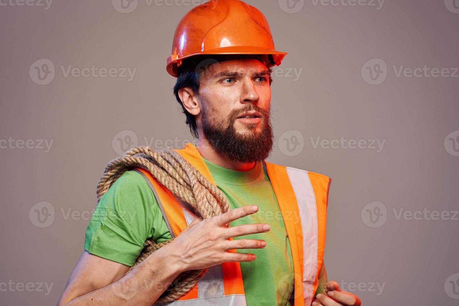 Bearded man in a construction firm orange paint industry photo