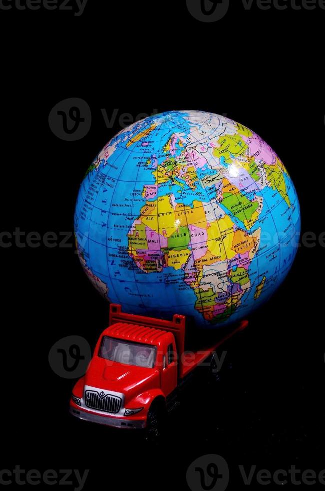 Red toy truck with a globe photo