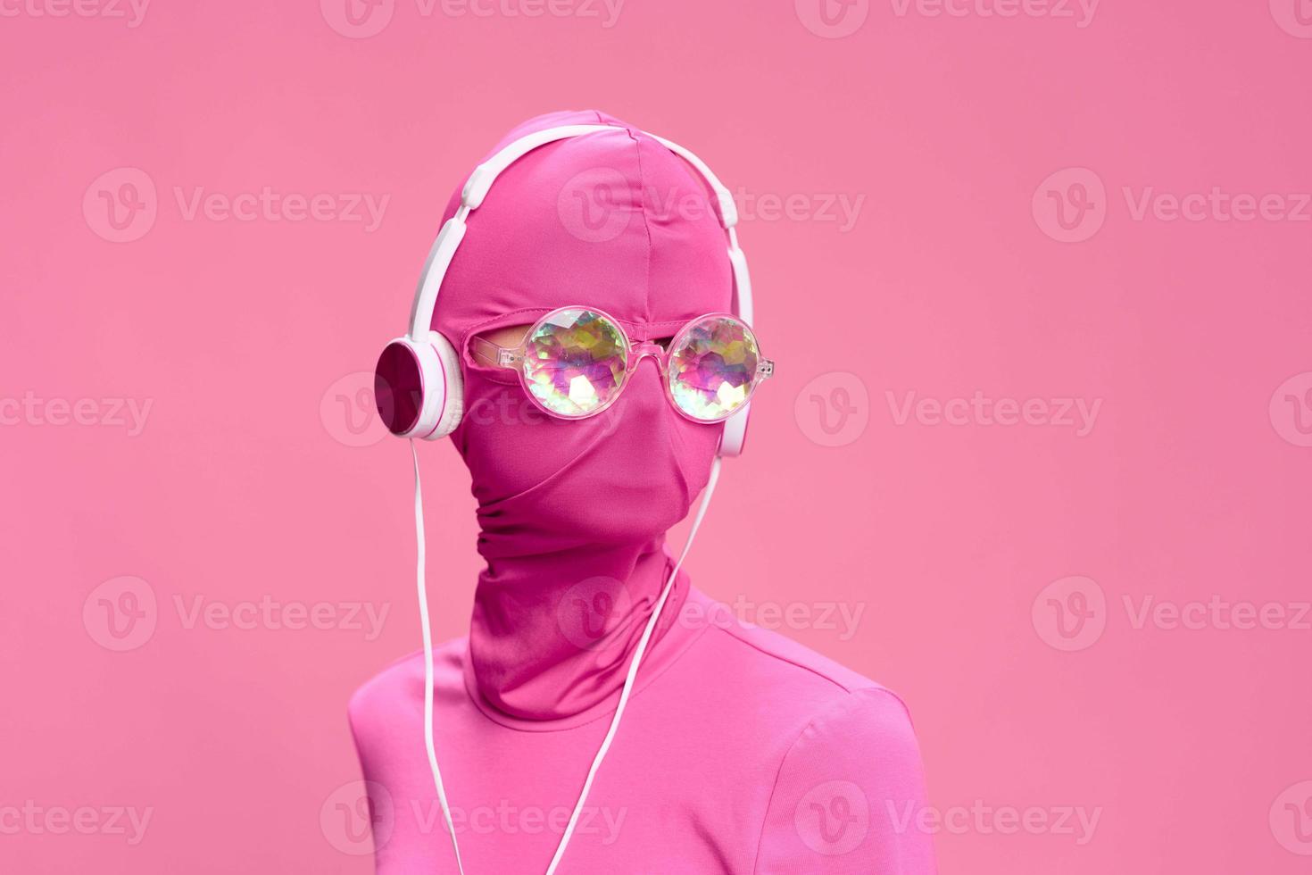 Creative crazy pink photo on a pink background with pink clothes and accessories, cyberpunk concept and conceptual art photography