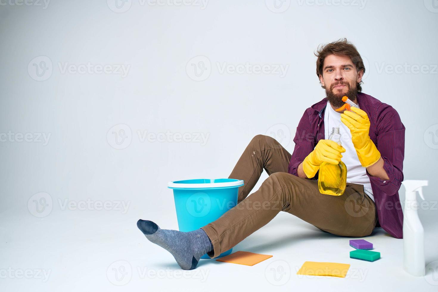 cleaner lying on the floor with a bucket of detergent cleaning service rendering Professional photo