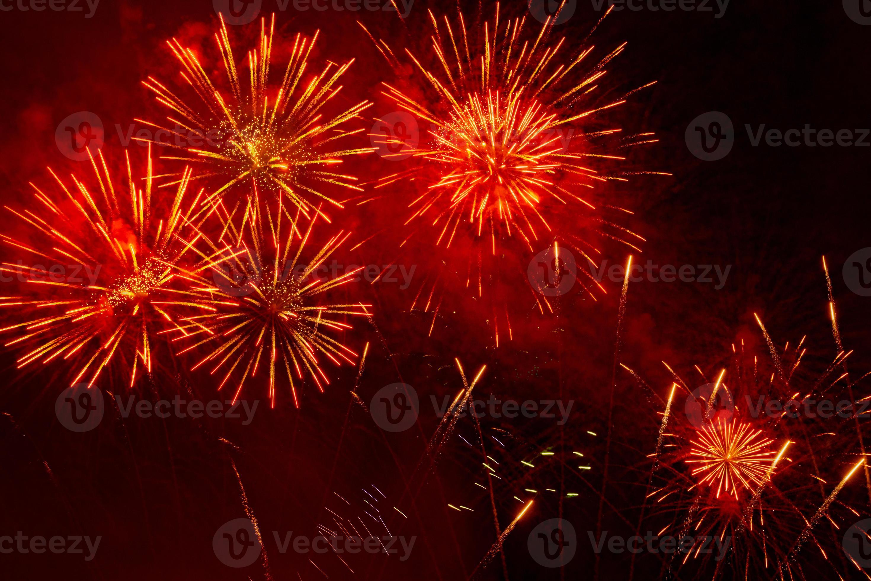 Beautiful orange fireworks display in the urban for celebration on dark