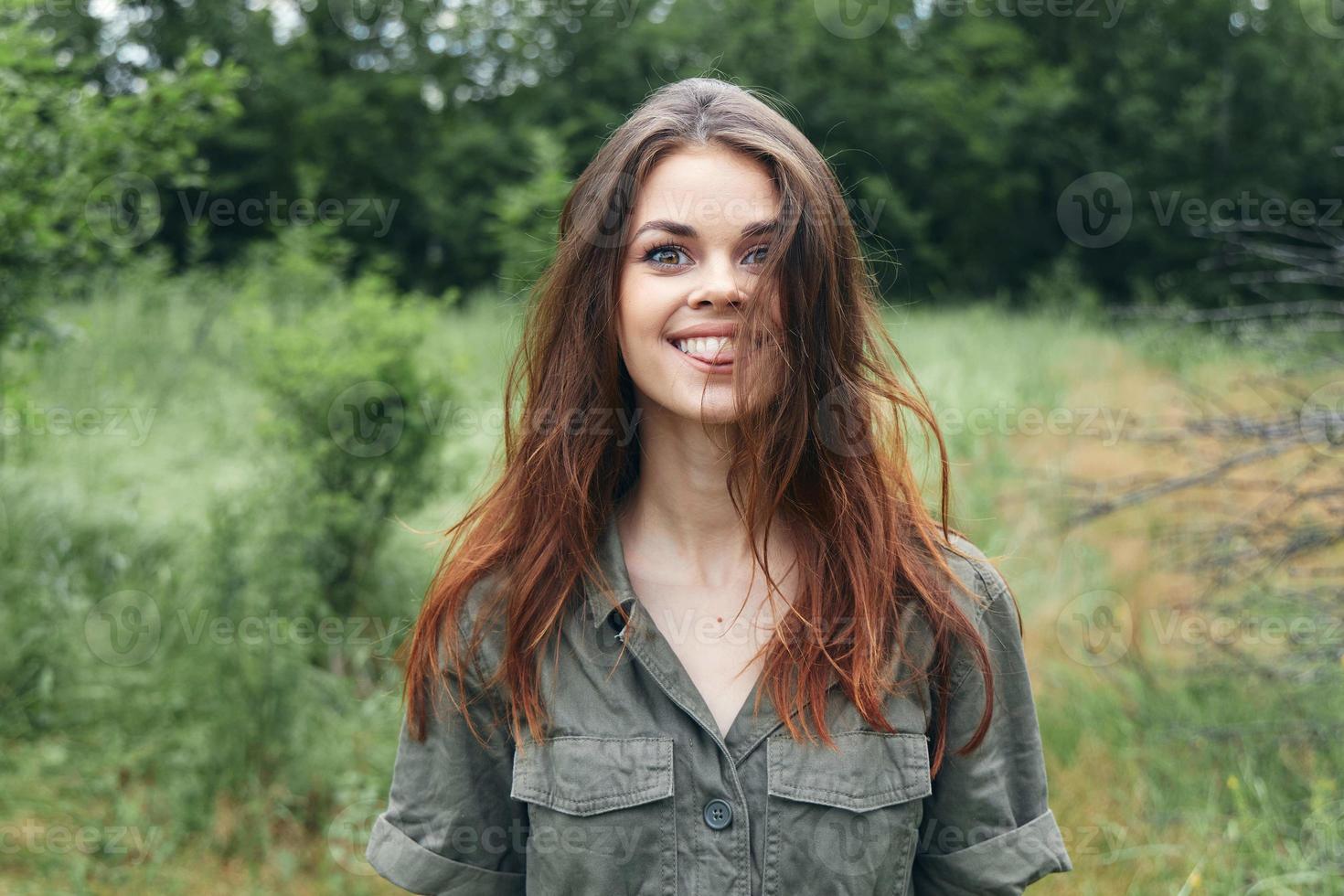 woman smile green jumpsuit nature trees meadow photo