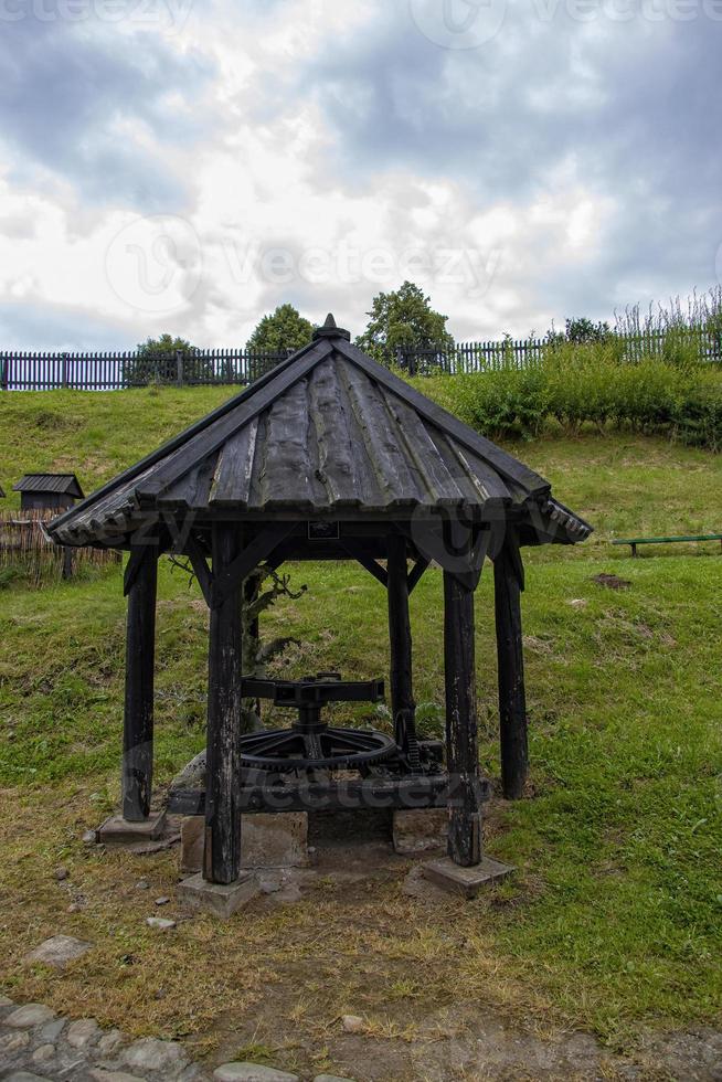 antique metal farm machinery in an open-air museum photo