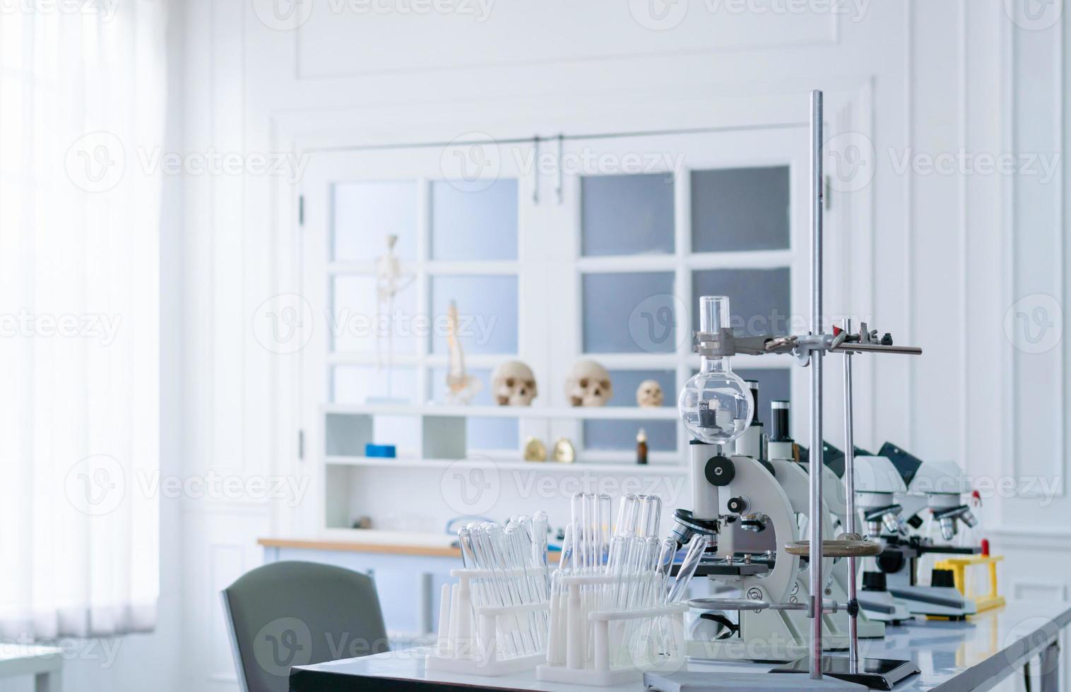 Science laboratory, Microscope and test tubes on the working table chemistry laboratory, scientist test tube with samples photo