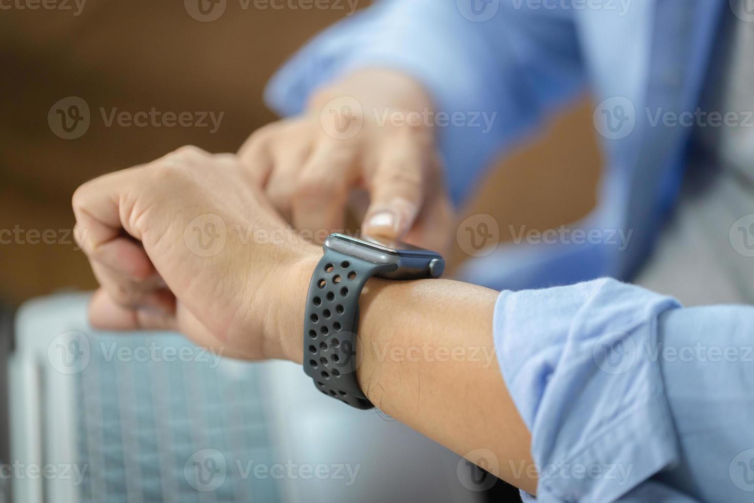 Close-ups of Hands using smart watches, Technology in use concepts photo