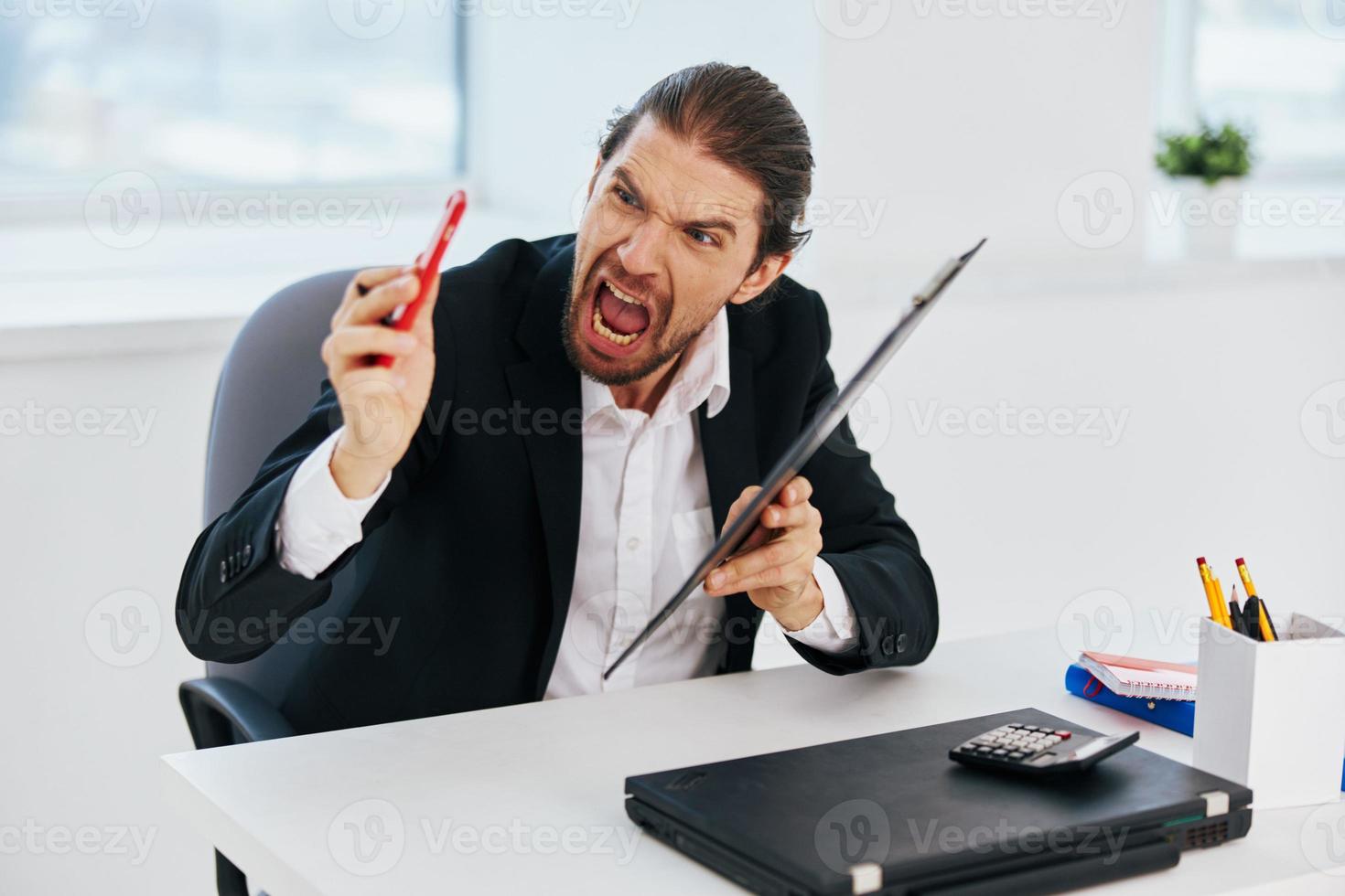 manager at the desk documents technology photo