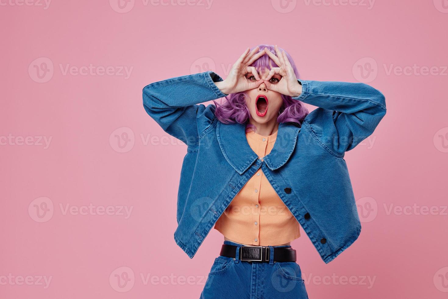 Portrait of a charming lady wavy purple hair blue jacket emotions fun studio model unaltered photo