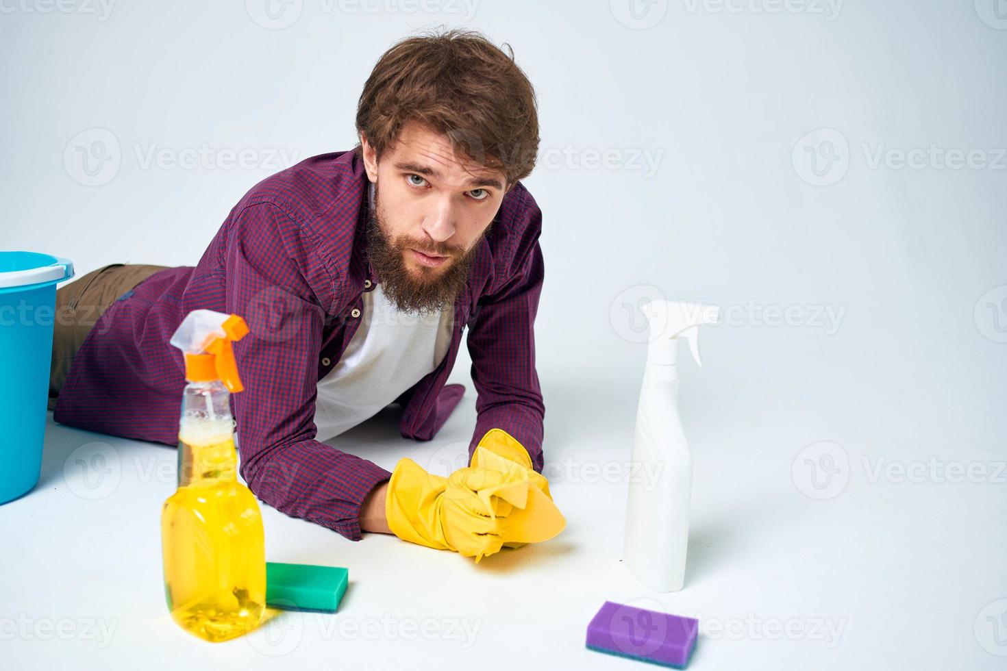 man with a bucket on the floor detergent service lifestyle photo