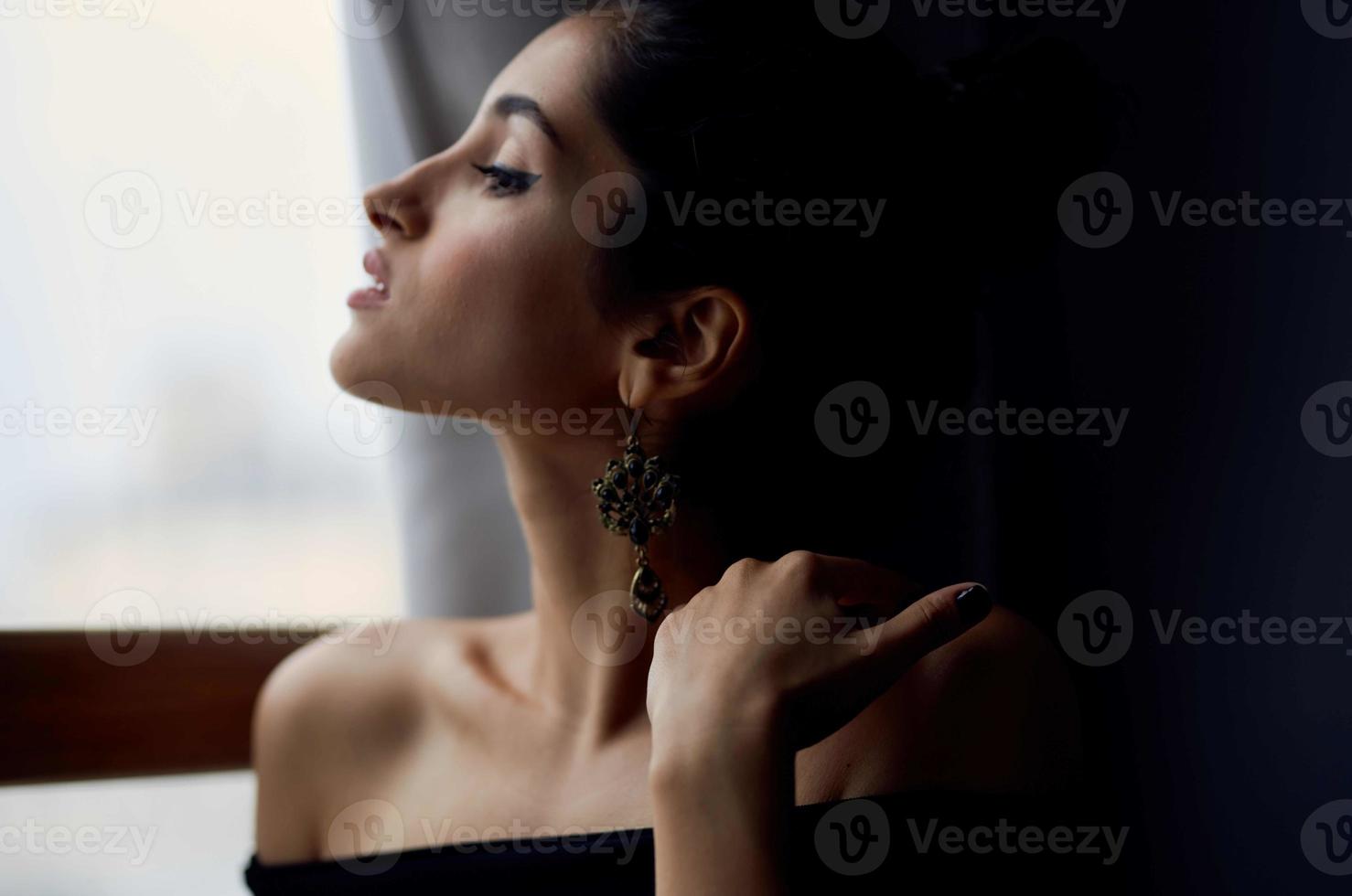 pretty woman holding a camera near the window decoration fashion fashion model photo