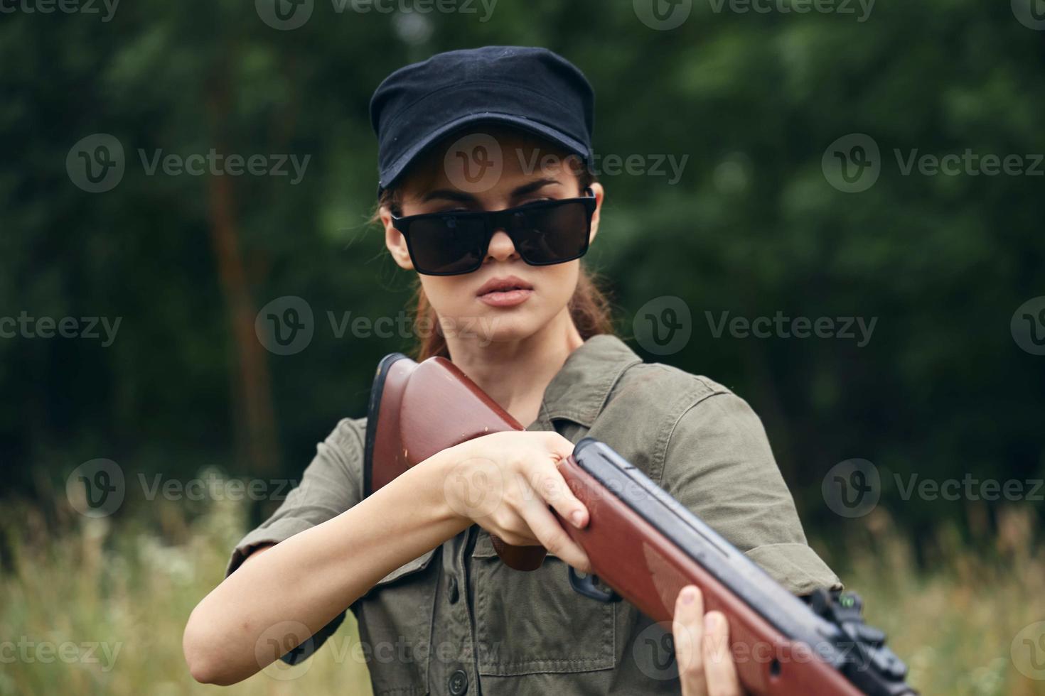 Woman Sunglasses shotgun hunting lifestyle black cap photo