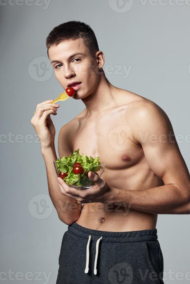 very us muscular body and a plate of salad diet energy health photo