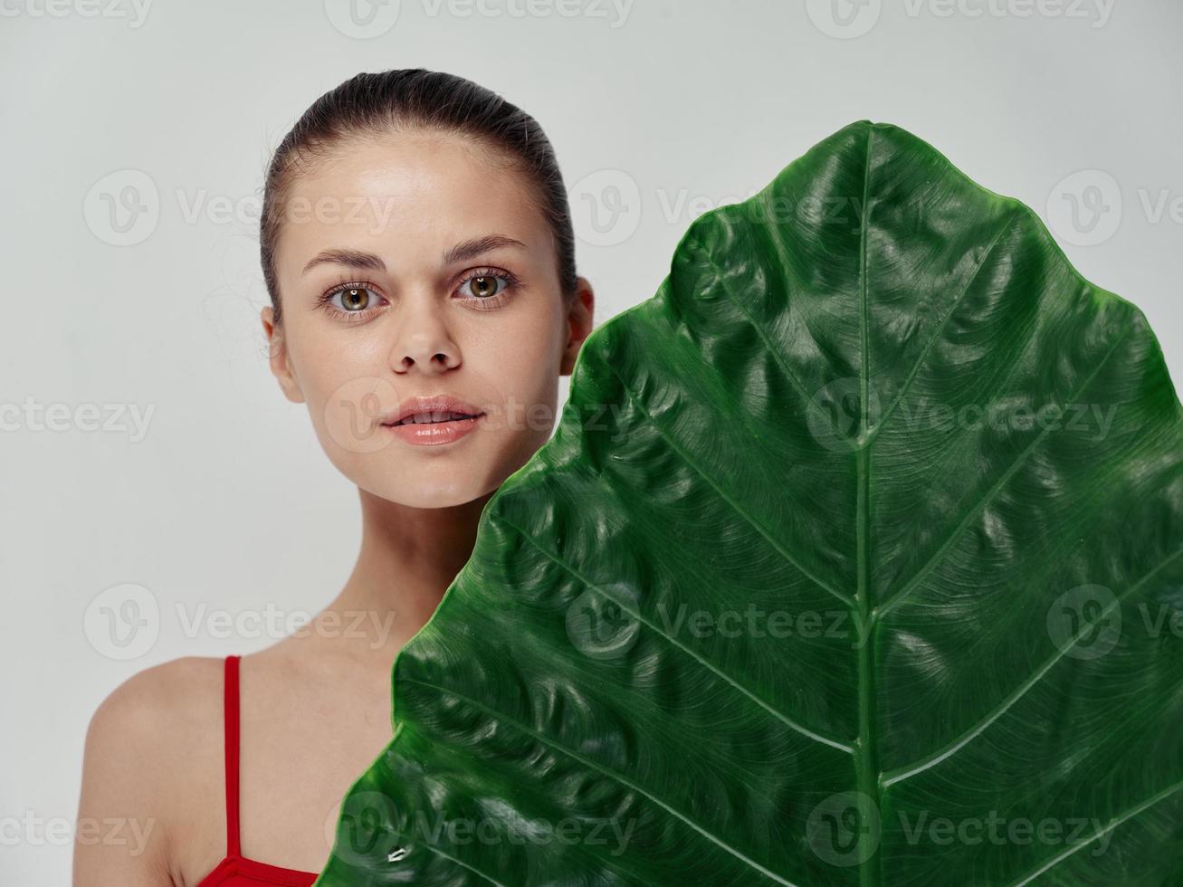 clean skin beautiful woman green leaf palm tree with isolated background pattern photo