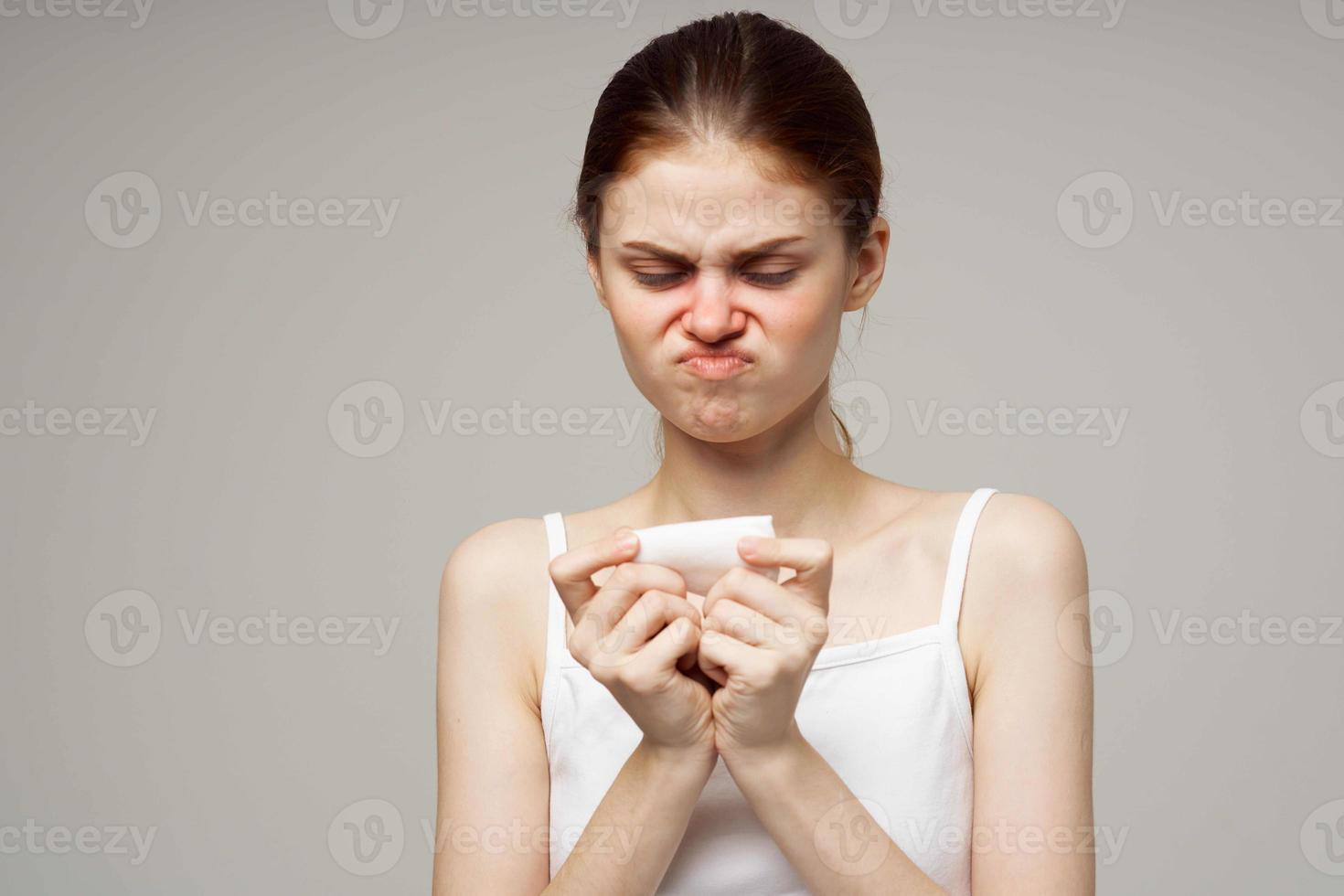 sick woman in white t-shirt with a scarf isolated background photo
