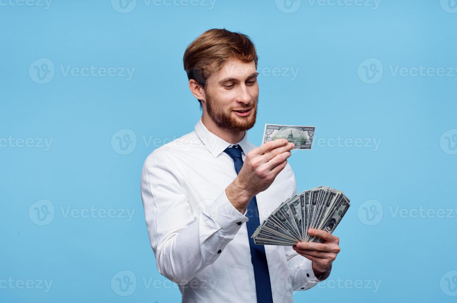 Virgo man in tie with money in hands wealth success self-confidence photo