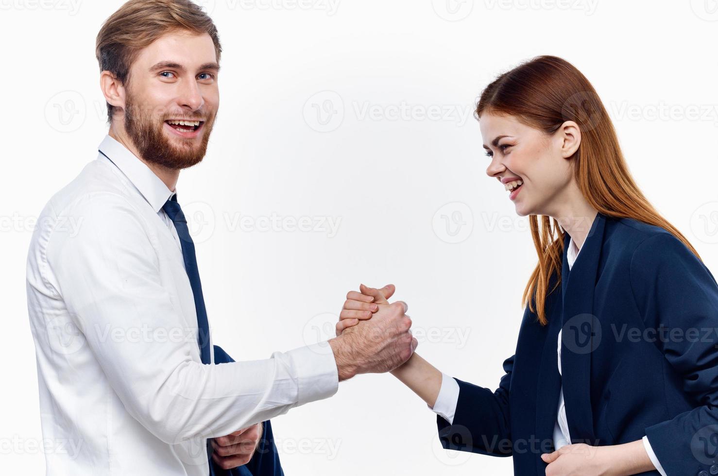 man and woman in suits are holding hands of work colleagues close-up photo