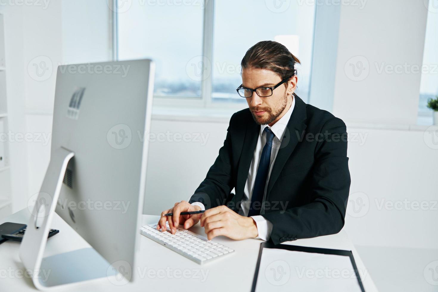 man in a suit documents in hand communication by phone Chief photo