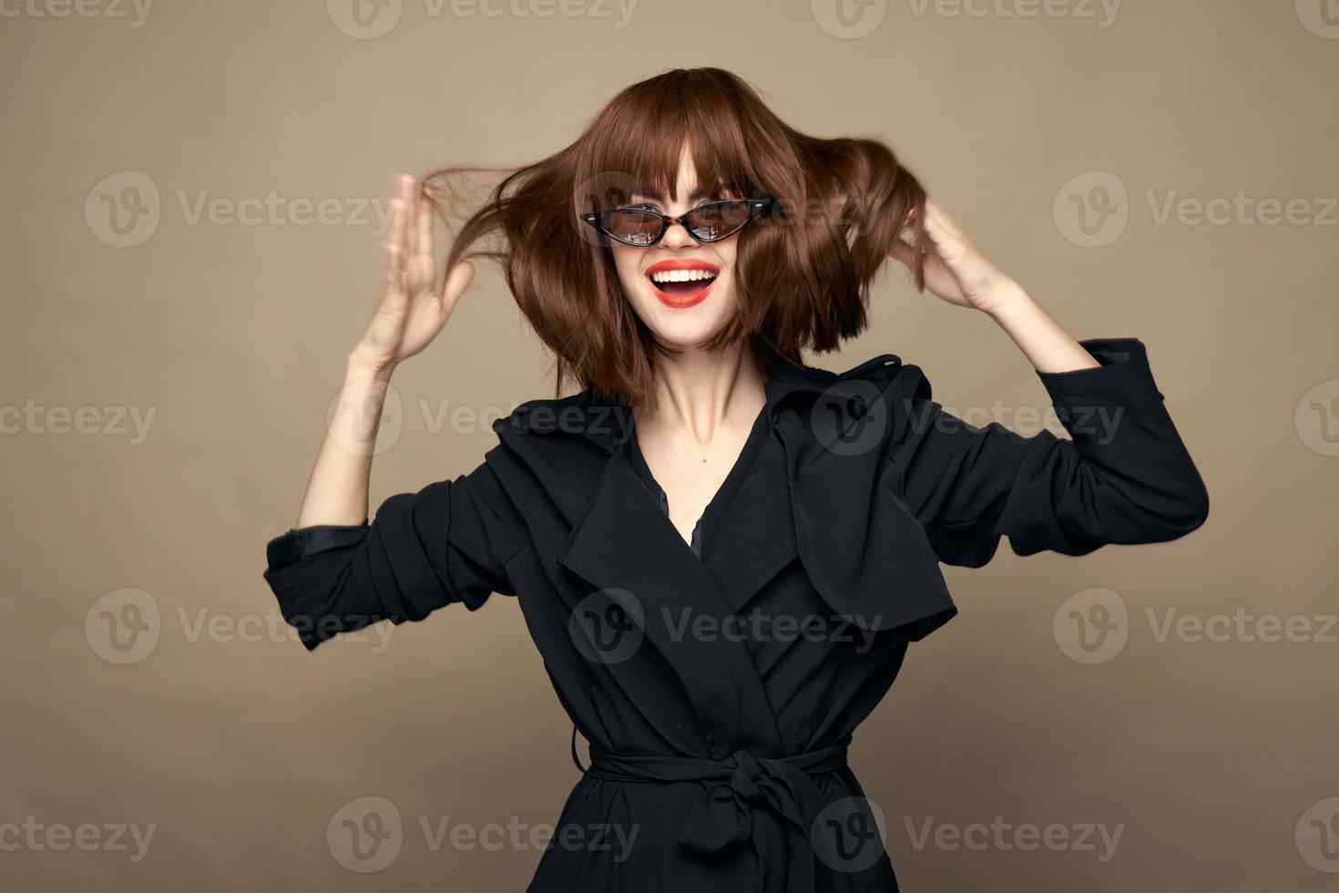 Beautiful woman dark coat elegant style smiling indoors photo