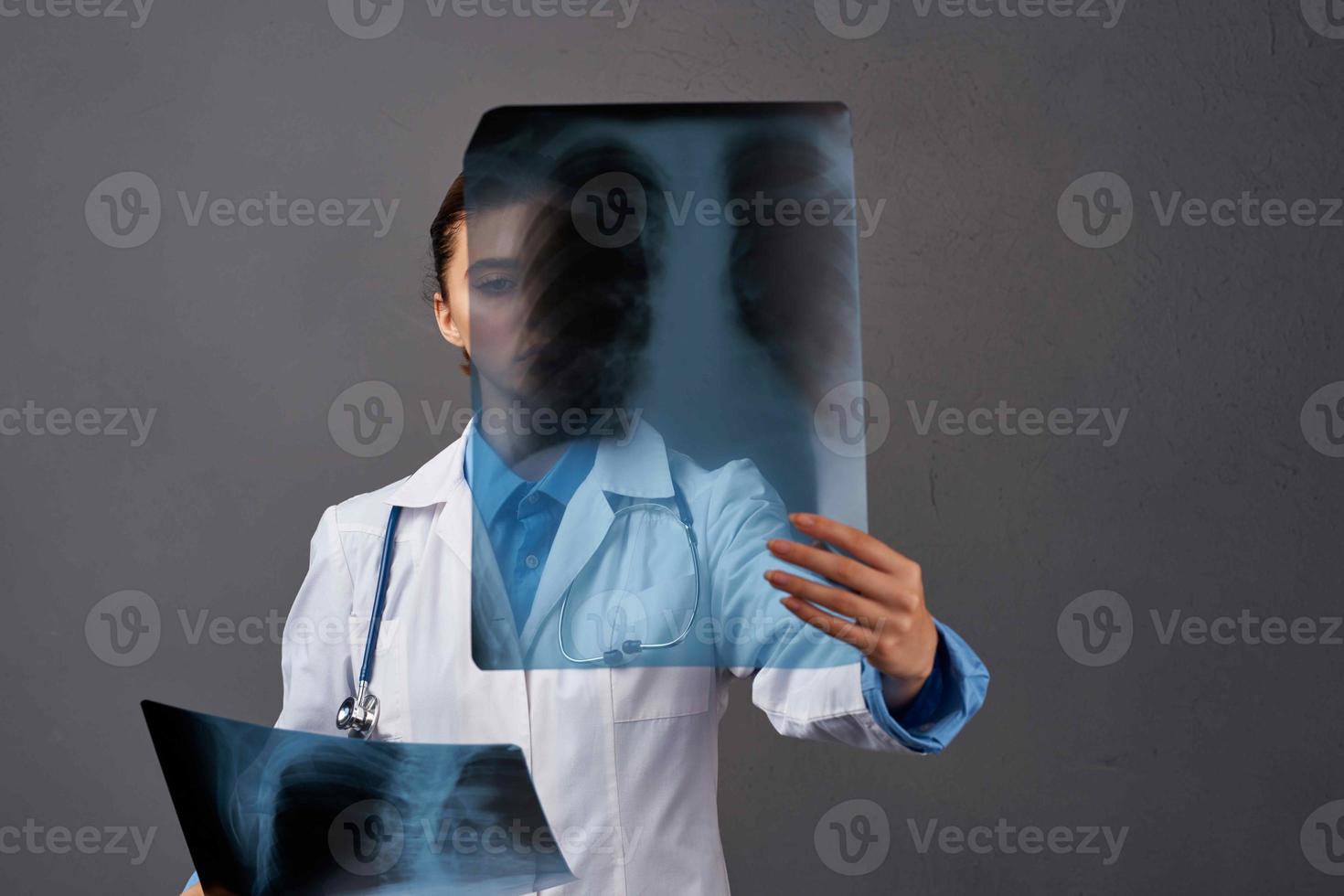 female doctor white coat medicine examination dark background photo