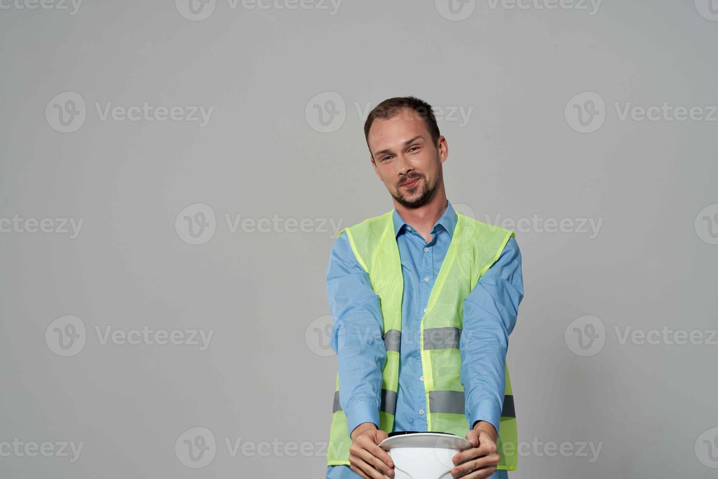 man in white helmet protection Working profession light background photo