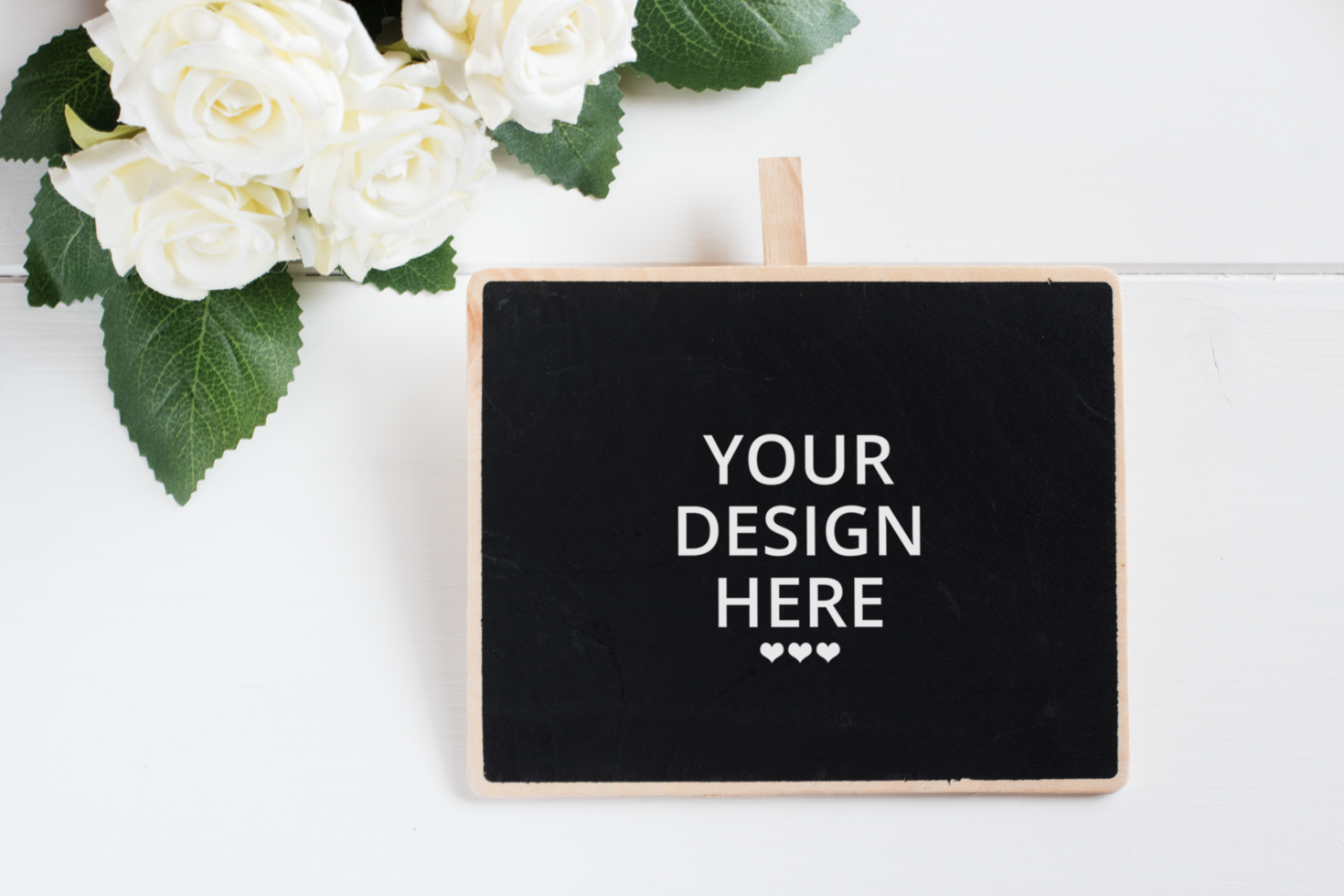 Chalkboard with flower bouquet and florist scissors on wooden table mockup. psd