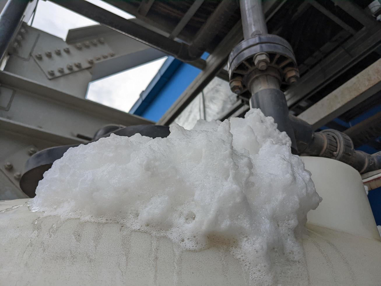 Foaming chemical cleaning water treatment plant reaction of fresh water and impurities. The photo is suitable to use for water treatment plant poster, process cleaning background and content media.