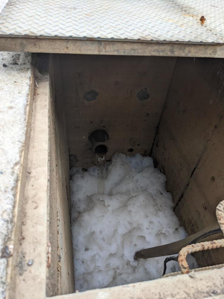 Foaming bubble of waste water on power plant, when treatment is on going. The photo is suitable to use for industry background photography, power plant poster and electricity content media.