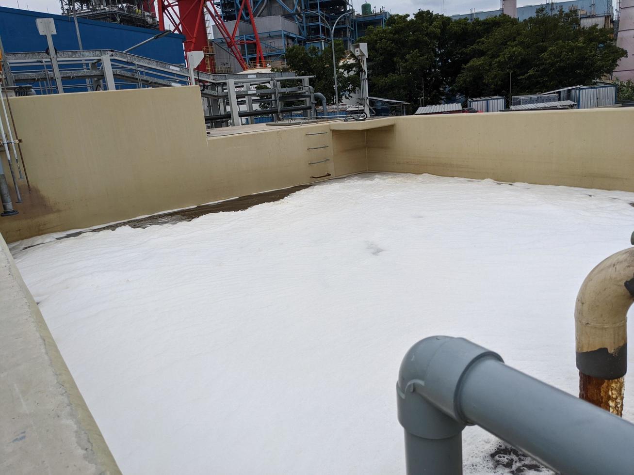 Foaming bubble of waste water on power plant, when treatment is on going. The photo is suitable to use for industry background photography, power plant poster and electricity content media.