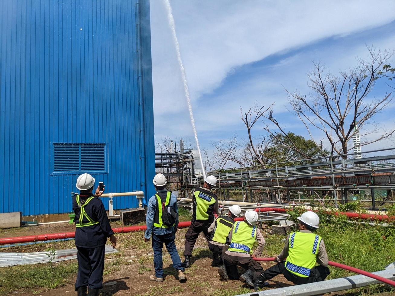 Spray water test hydrant tower on the combine cycle power plant. The photo is suitable to use for industry background photography, power plant poster and electricity content media.