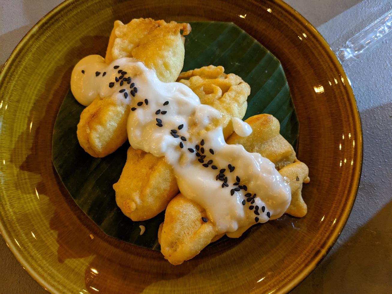 Banana Fries traditional food of Javanese with creamy topping and Choco chips. The photo is suitable to use for traditional food background, poster and food content media.