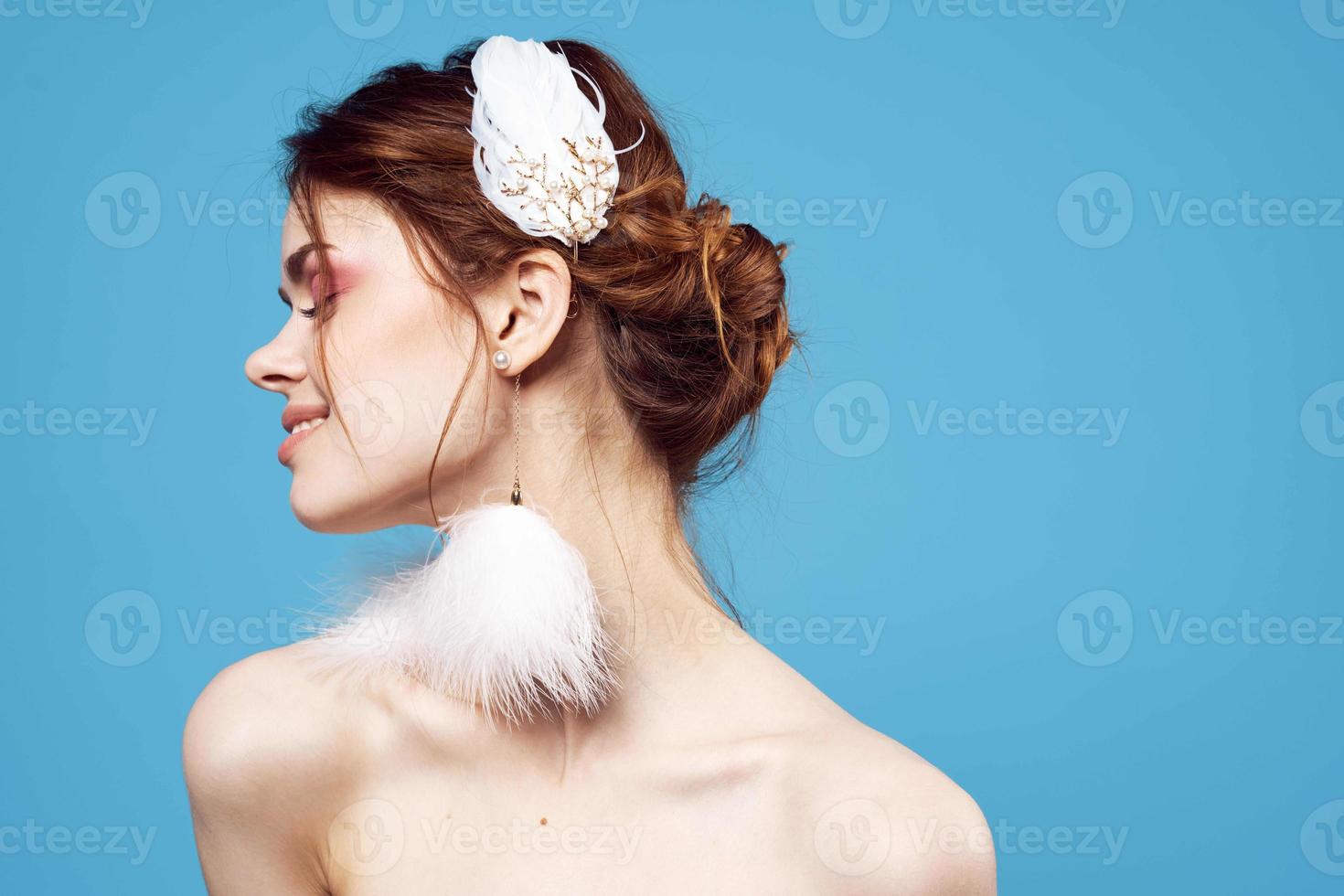 woman fluffy mesh bright makeup naked shoulders blue background photo