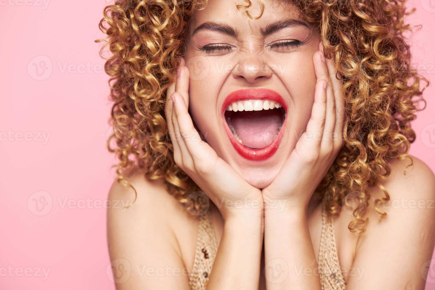 woman curly hair Red lips closed eyes studio photo