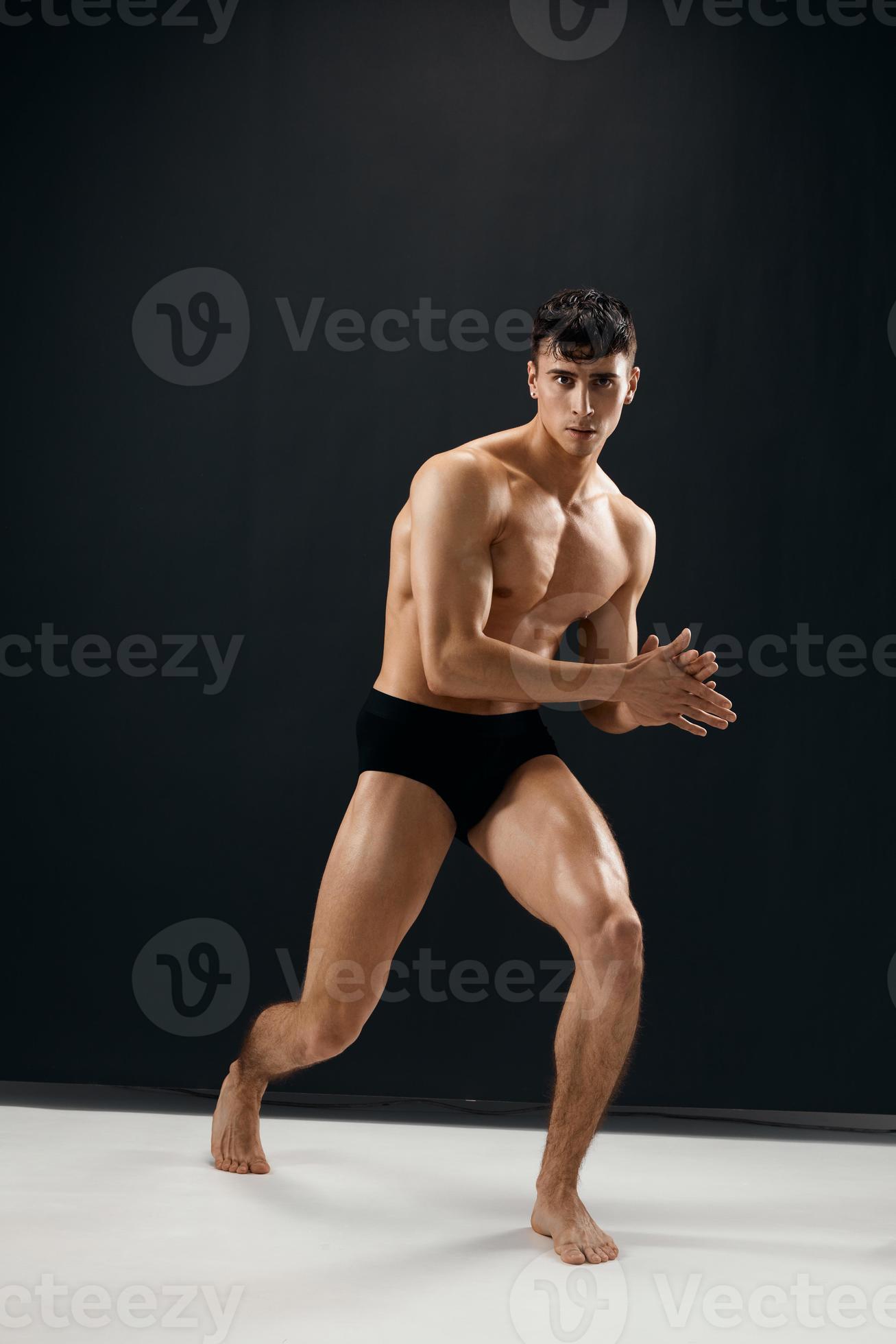 athletic men with a pumped-up muscular body black panties posing